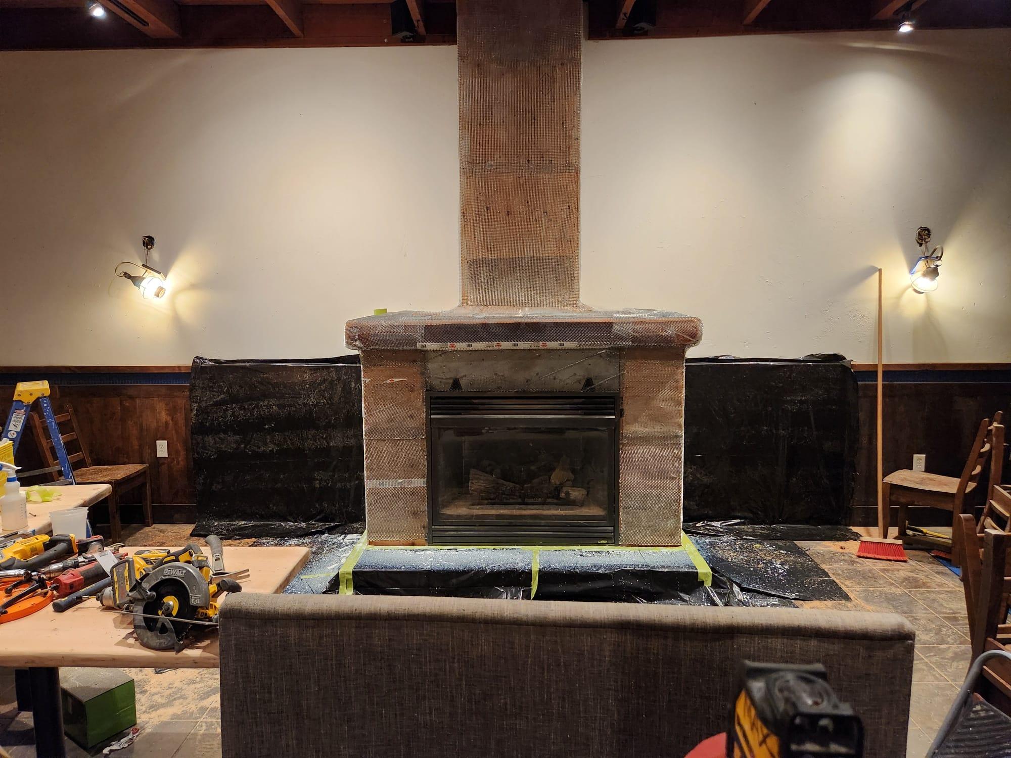 Restaurant fireplace fully reinforced with metal mesh before coating