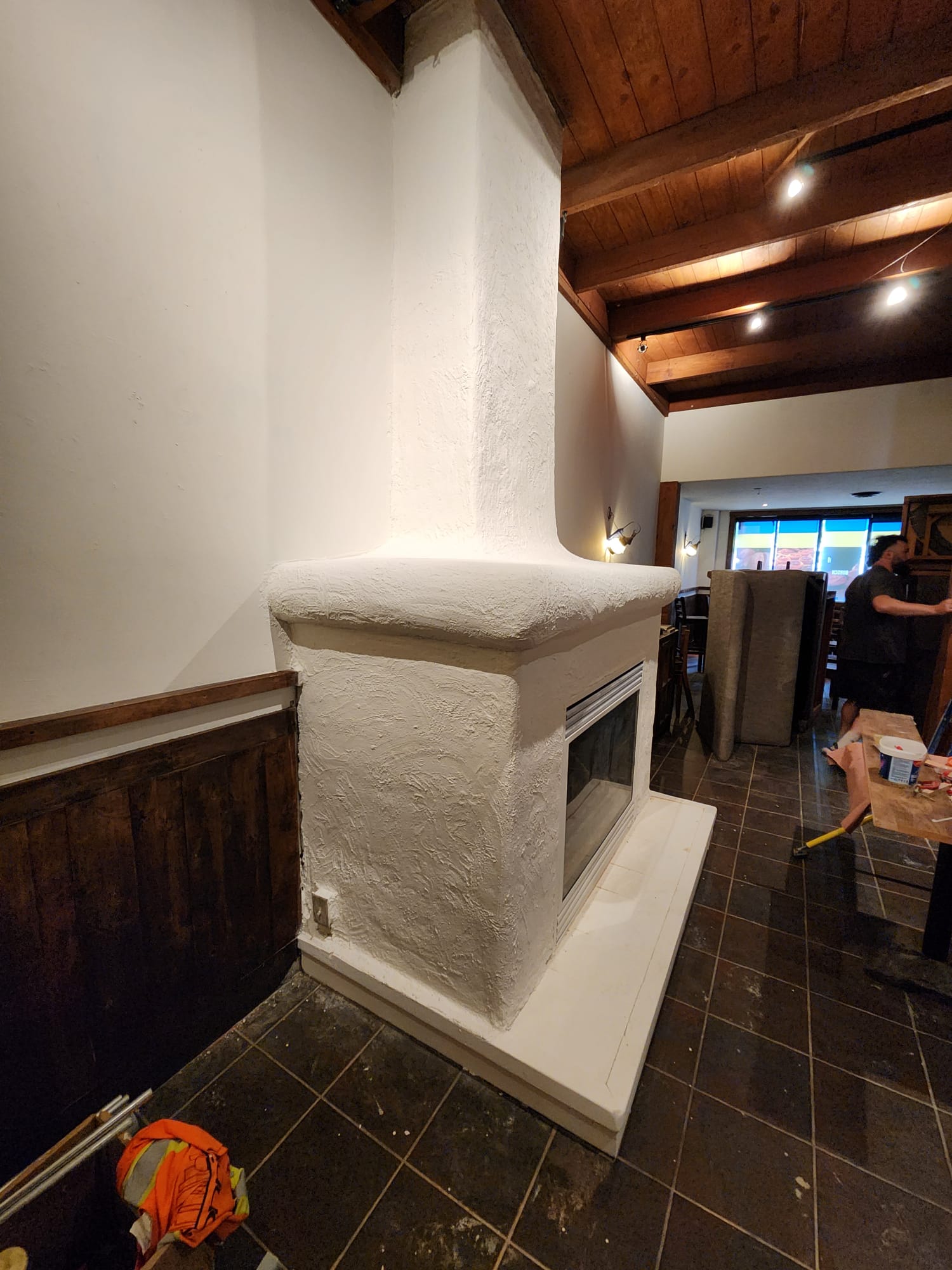 Completed white textured fireplace inside the Lonsdale restaurant