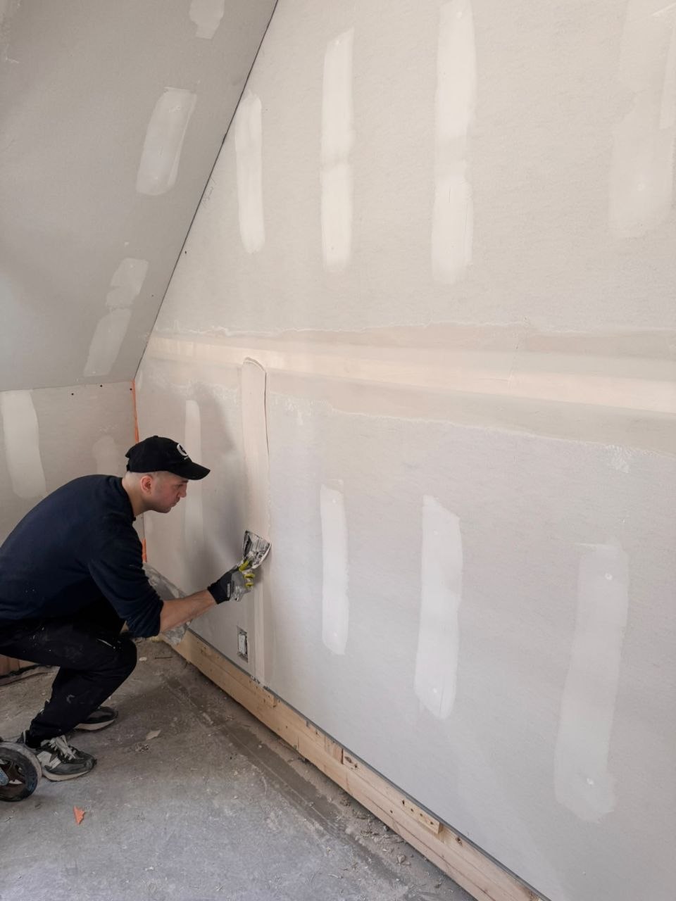 Drywall seams being finished before painting in a Whistler residence